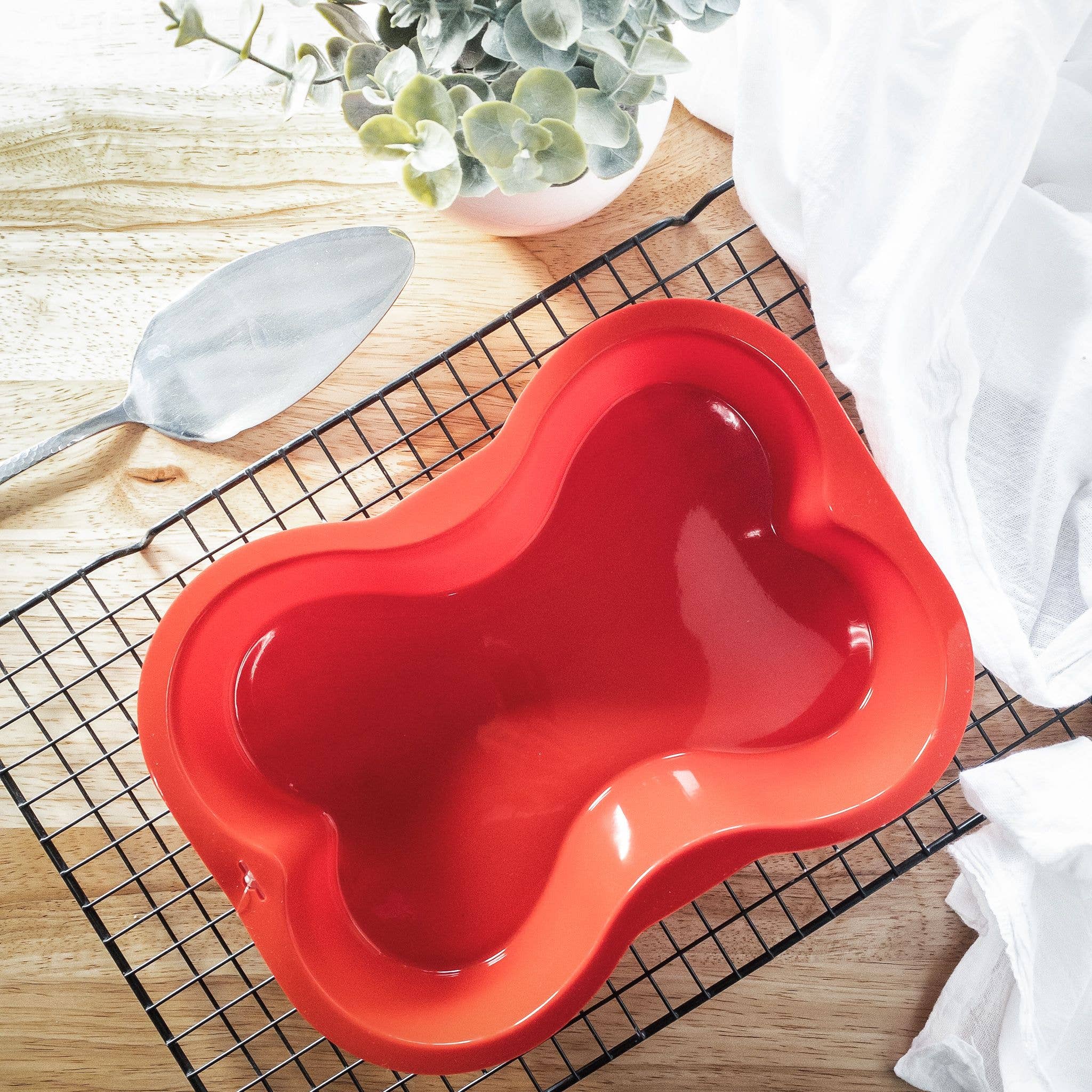 Puppy Cake LLC - Dog Bone Shaped Silicone Cake Pan: Pink